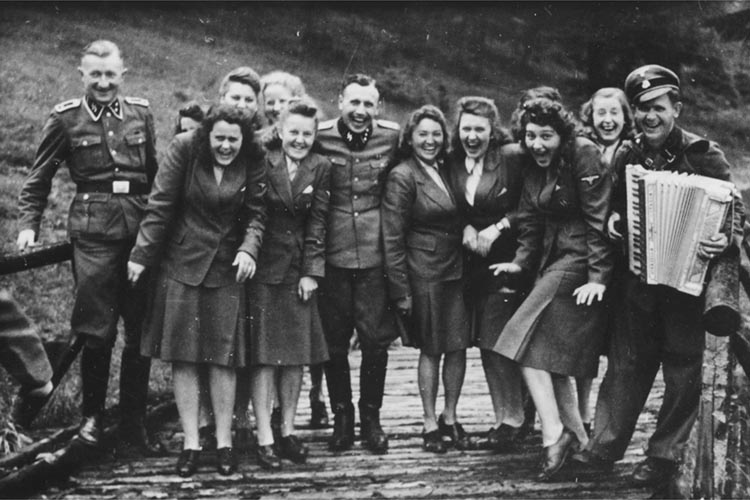13 - Laughing at Auschwitz  SS auxiliaries poses at a resort for Auschwitz personnel 1942