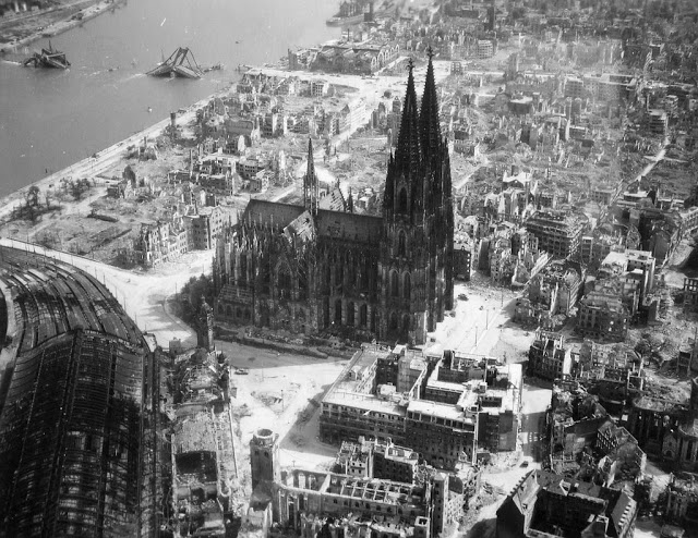 17 - The Cologne cathedral stands tall amidst the ruins of the city after allied bombings 1944